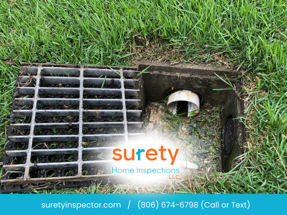 Yard drainage system and drain grate in Arlington, TX inspected during a home inspection.