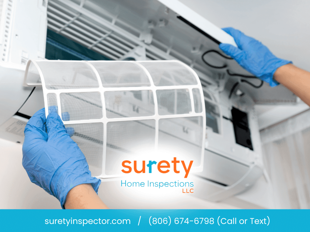 Home inspector checking HVAC filter in Arlington, TX, during a home inspection