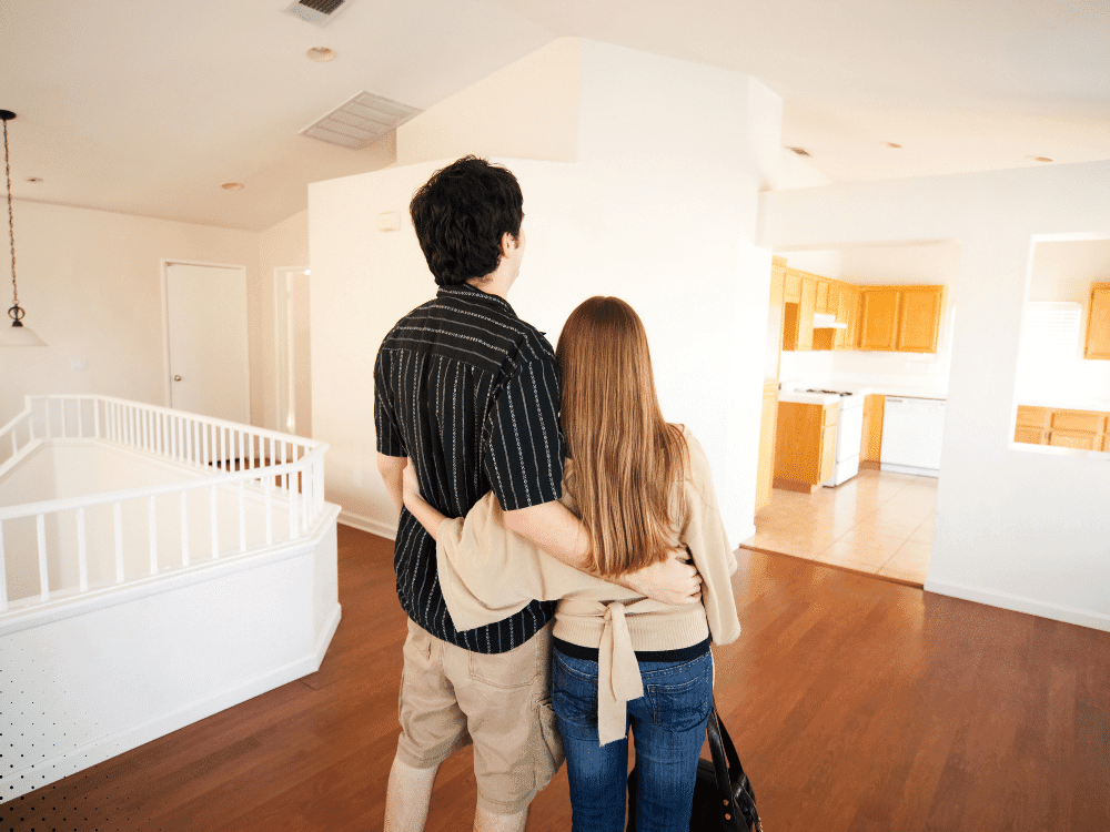 Couple inspecting the interior of a home in Arlington TX as part of a sewer scope and home inspection