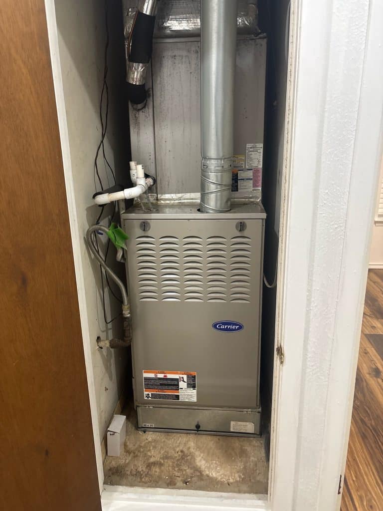 Water-heater venting equipment inside a utility closet during an Irving TX home inspection
